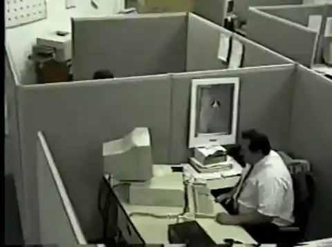 Office worker losing it at his computer